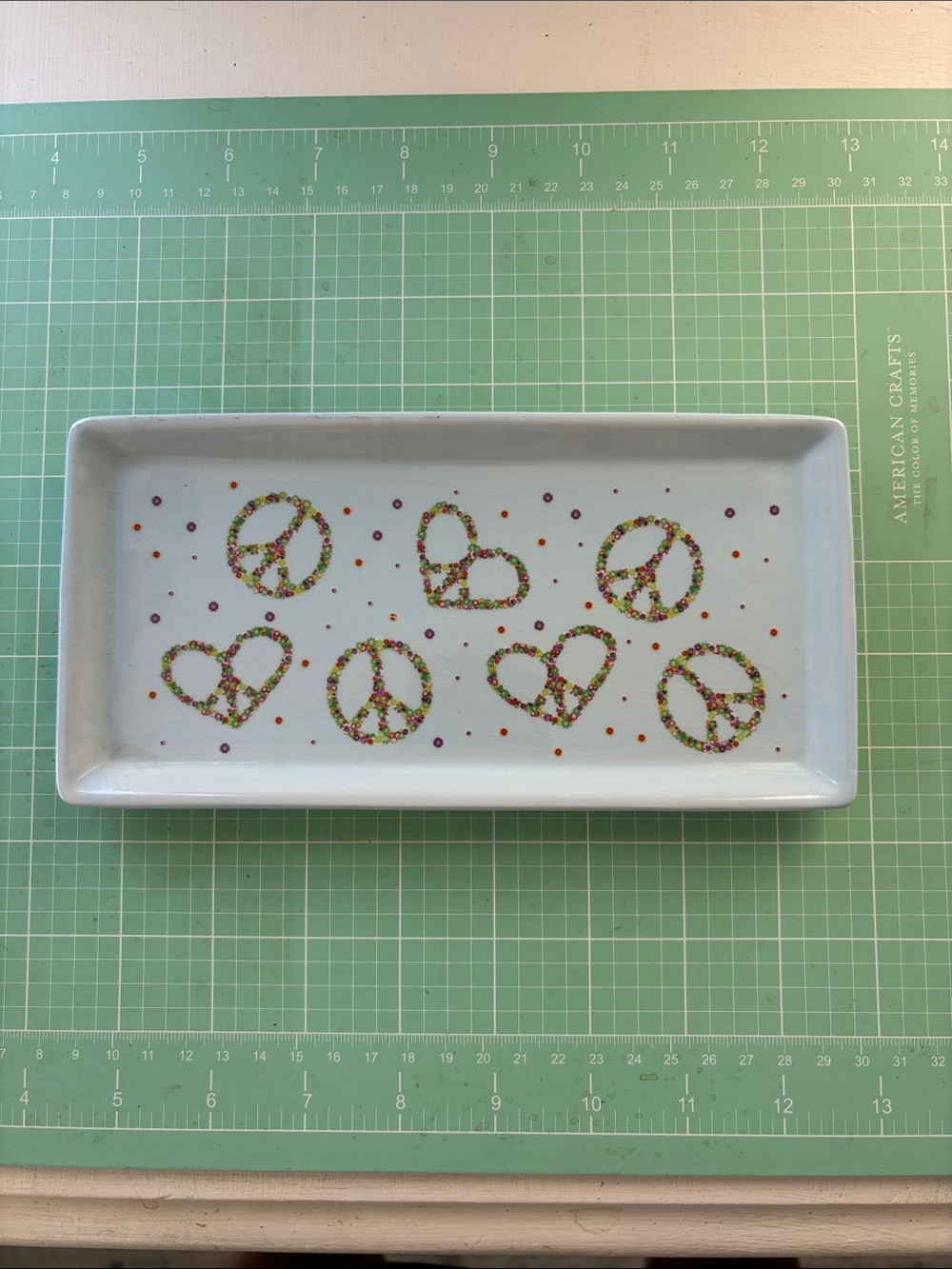 Boston Warehouse White Trinket Tray with Multicolor Peace & Heart Motifs